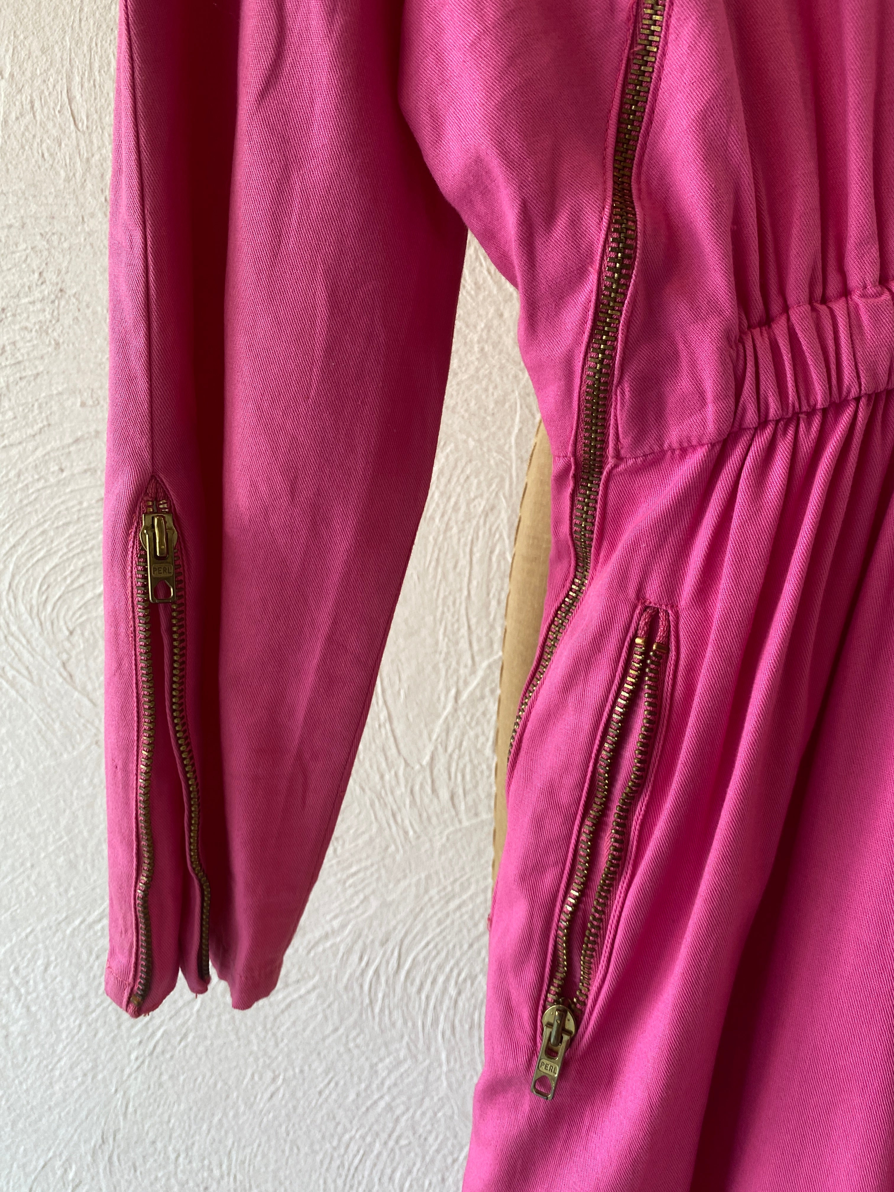 zip pink jump suit
