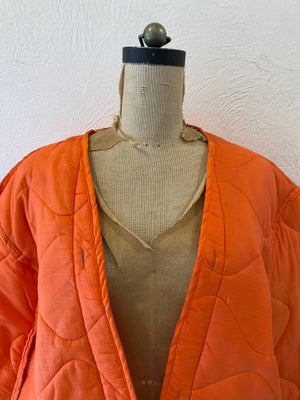 orange quiltting jacket