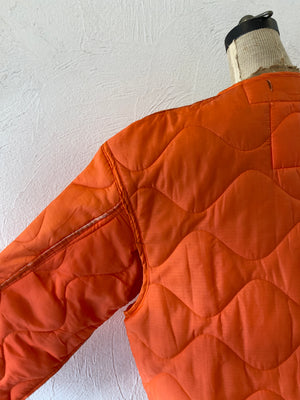 orange quiltting jacket