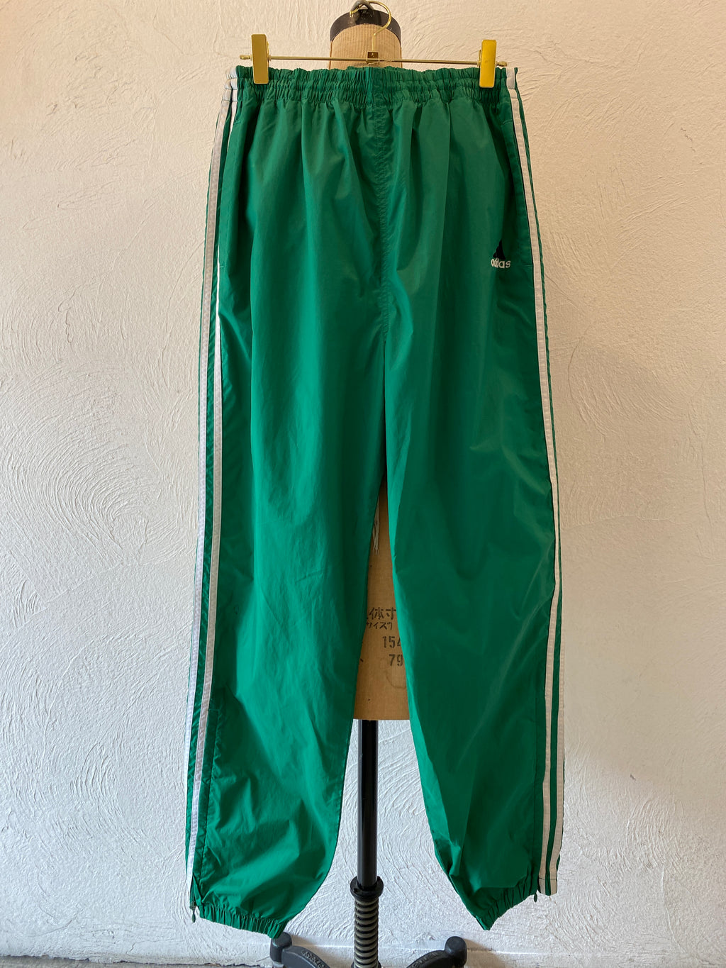 green adidas nylon pants