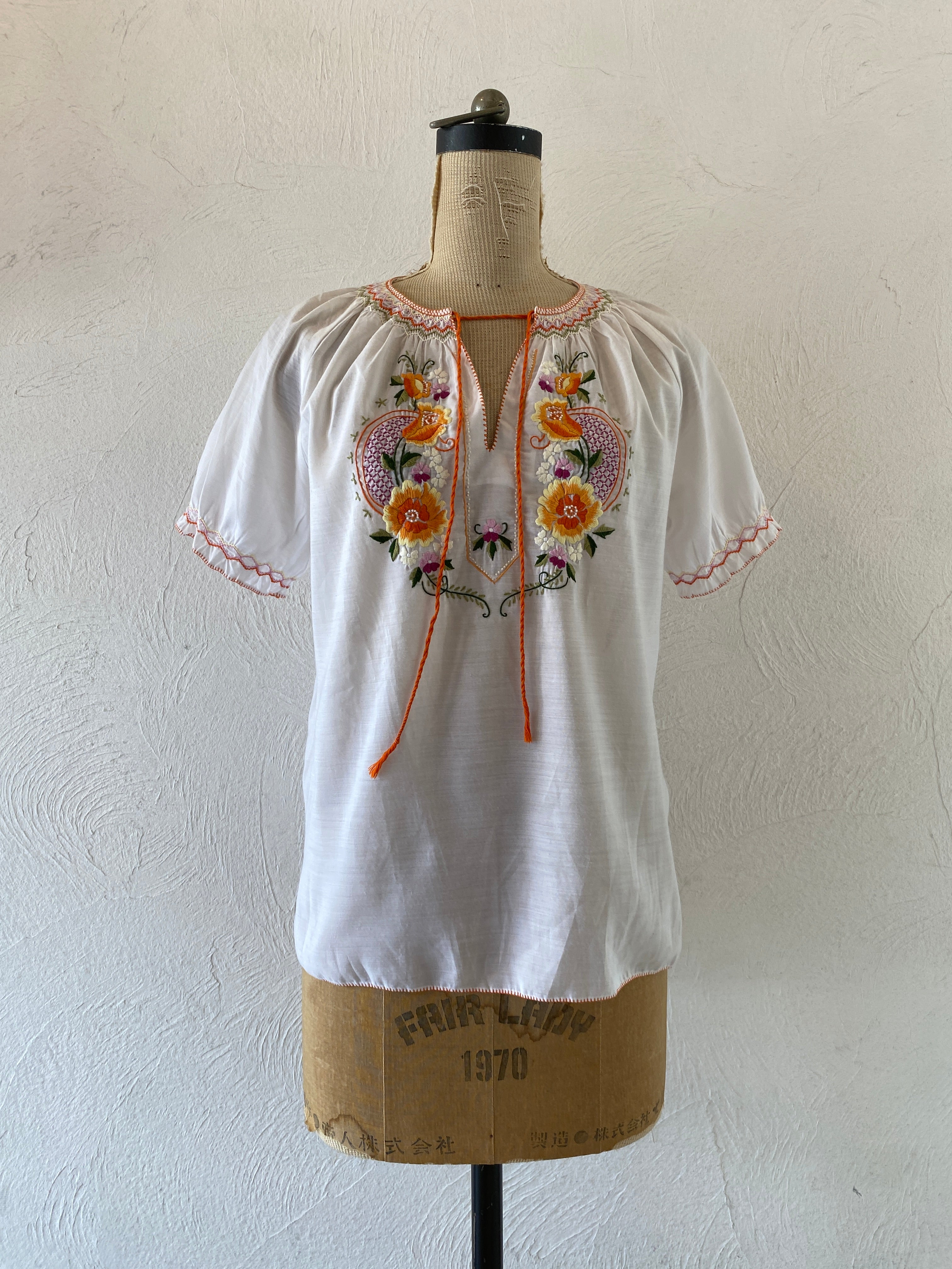 orange embroidery blouse