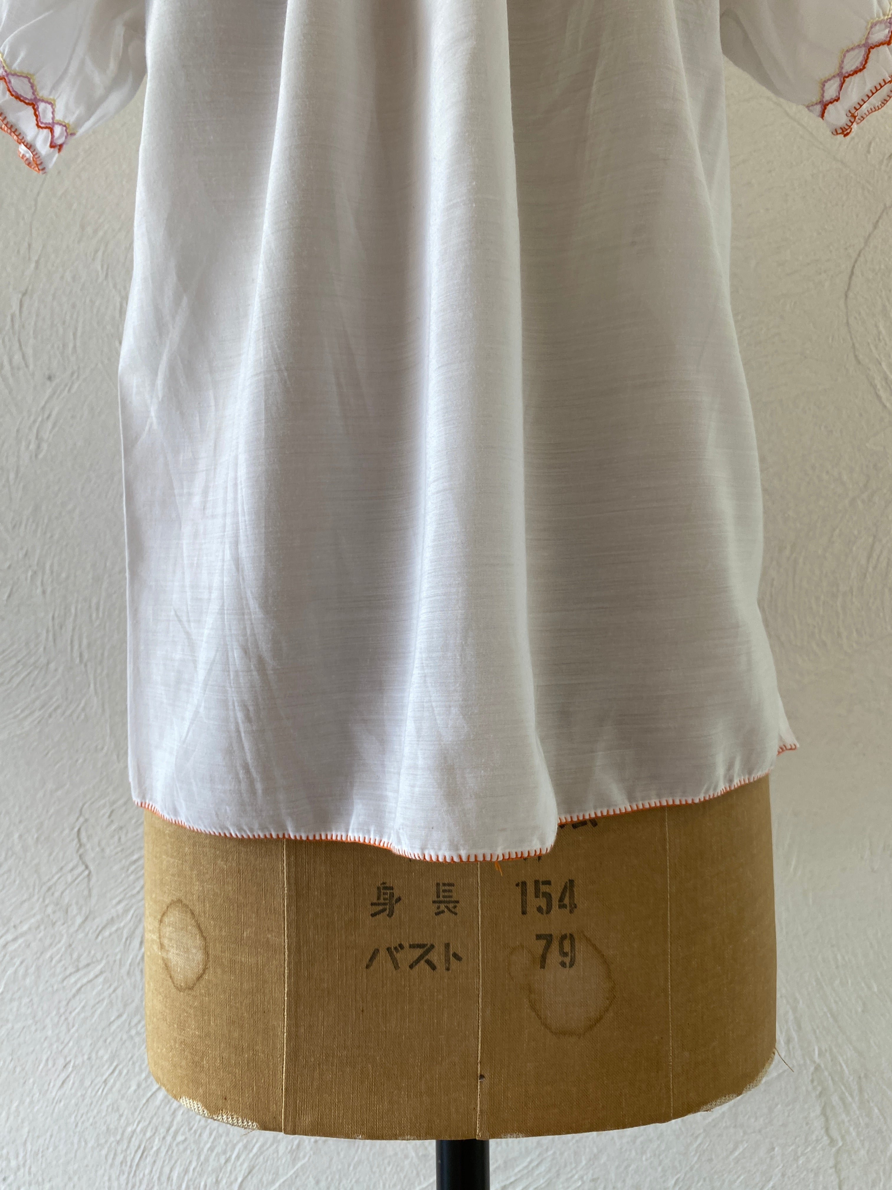 orange embroidery blouse