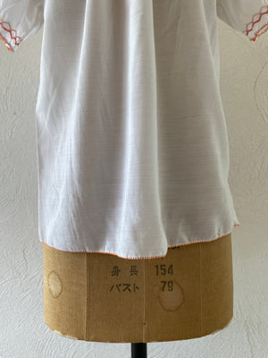 orange embroidery blouse